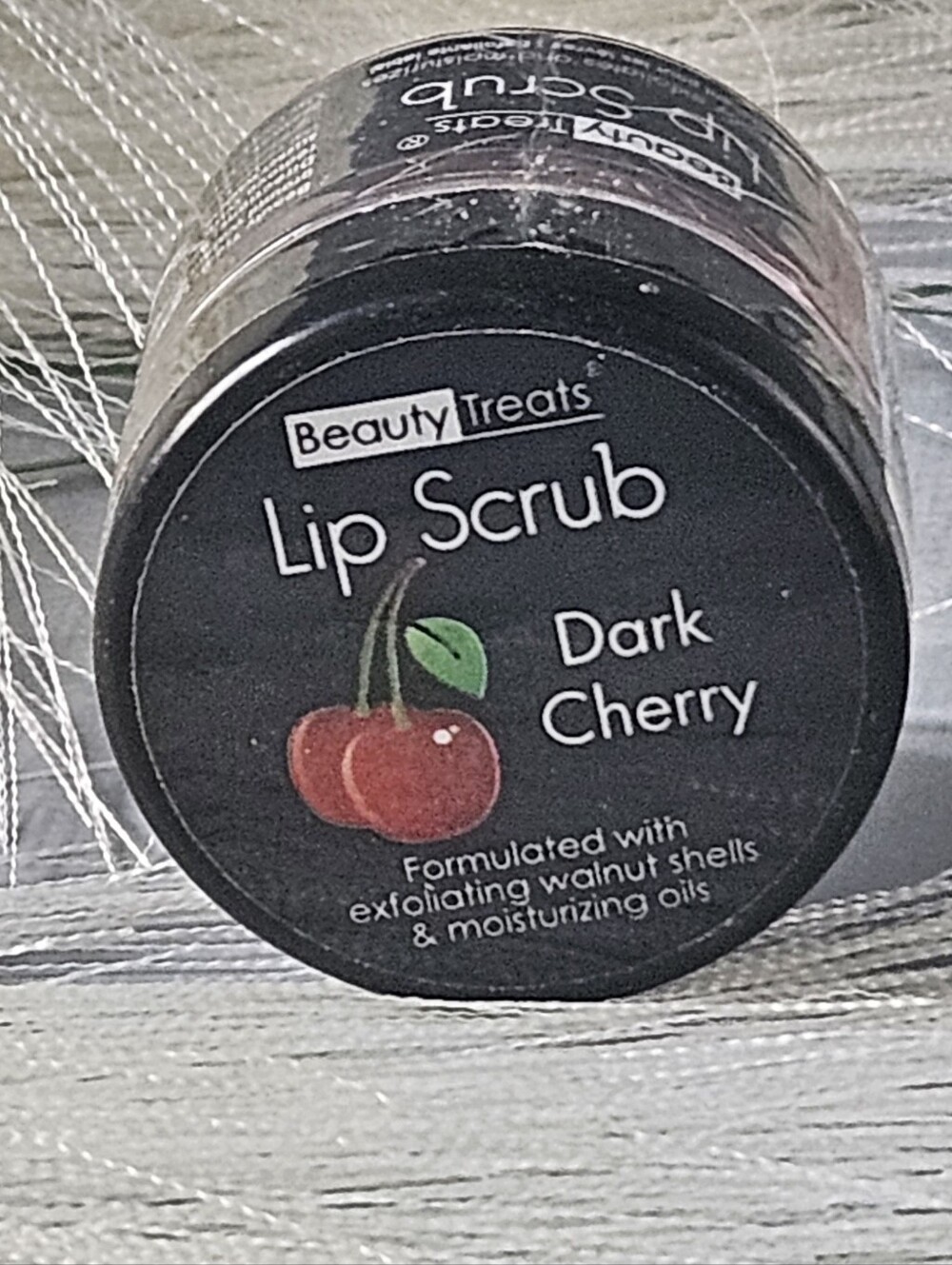 Beauty Treats Lip Scrub sealed in the Dark Cherry flavor.Size: 0.37 oz / 10.5 g